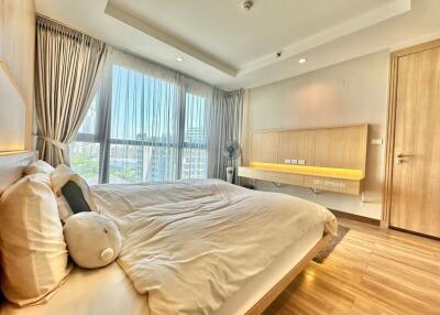 Bright and well-appointed bedroom with city views