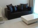 Modern living room interior with comfortable sofa and sleek coffee table