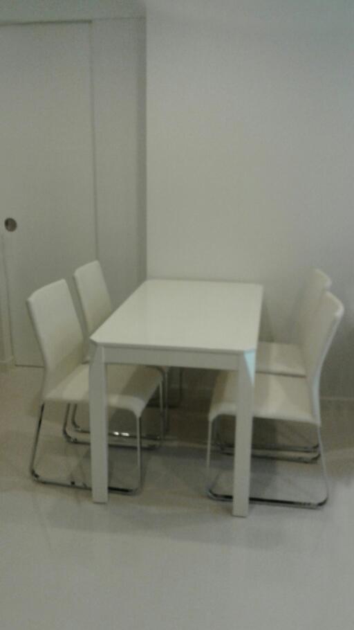 Modern dining room with white table and chairs