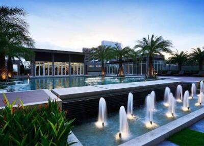 Luxurious building with a modern exterior and fountains