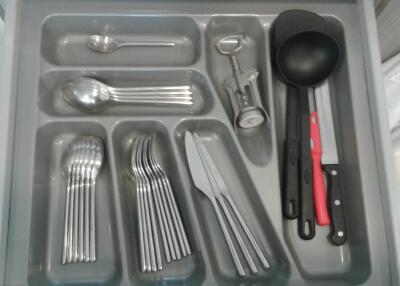 Organized kitchen drawer with utensils