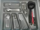 Organized kitchen drawer with utensils