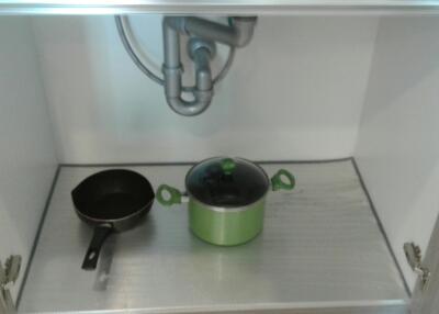 Under-sink kitchen cabinet with cooking pots