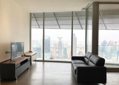 Modern living room with large windows overlooking cityscape