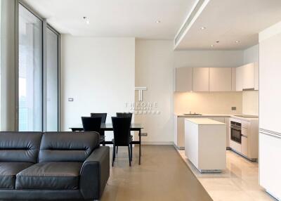 Modern living and dining area with open kitchen