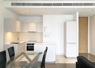 Modern kitchen with integrated appliances and dining area