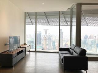 Modern living room with large windows and city view