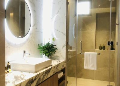 Modern bathroom with marble finishing and walk-in shower