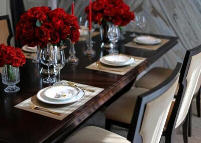 Elegant dining room with a wooden table and floral centerpieces