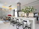 Modern kitchen with marble finishes and open plan dining area