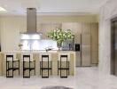 Modern kitchen with a large island and marble floors