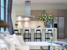 Modern kitchen with central island and bar stools