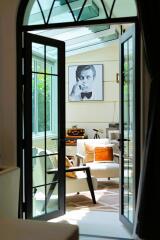 Elegant living room interior viewed through French doors
