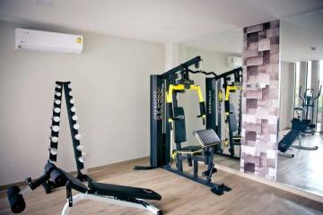 Home Gym with Exercise Equipment and Mirrored Wall