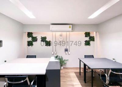Modern Office Interior with Desks and Decorative Plants