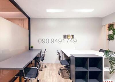 Modern office space with large meeting table and comfortable chairs