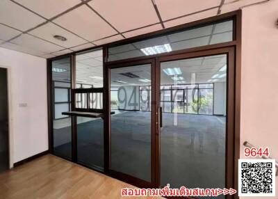 Modern office with large windows and an open floor plan
