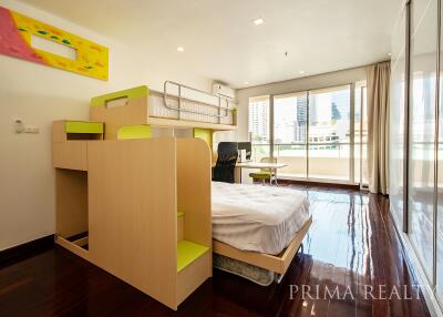 Spacious bedroom with bunk bed and large windows