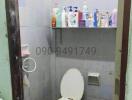 Compact bathroom with toilet and essential amenities