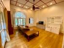 Spacious living room with natural light and hardwood floors