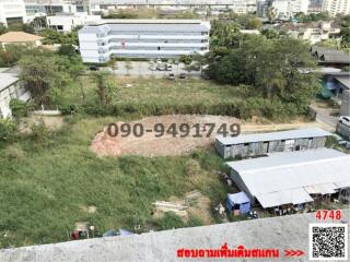 Urban vacant land available for development with buildings in the background