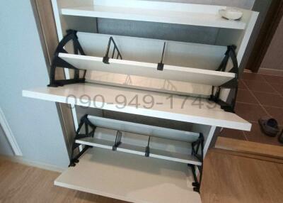Modern empty shoe rack within a residential space