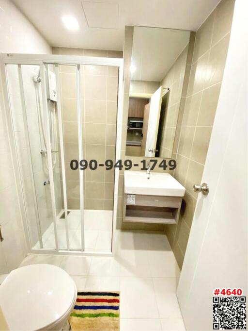 Modern bathroom interior with glass shower booth