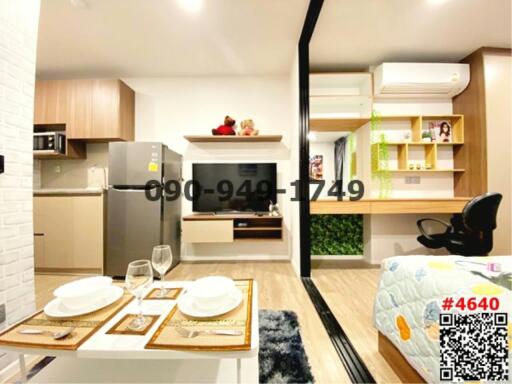 Modern studio apartment with integrated living space and kitchen