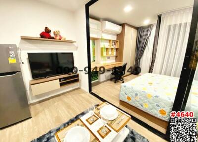 Modern and well-lit studio apartment with integrated living and sleeping area