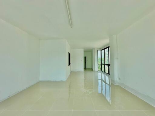 Spacious and bright unfurnished corridor in a modern building