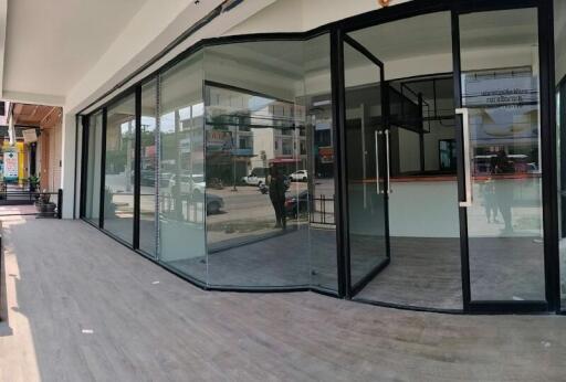 Modern commercial storefront with large glass windows and doors