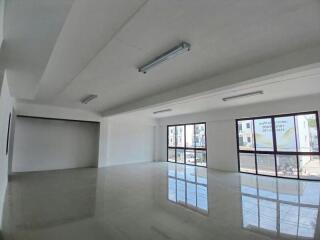 Spacious empty interior of a modern building with large windows