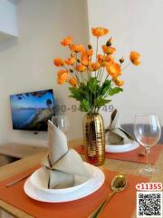 Elegant dining setup with decorative flowers and tableware