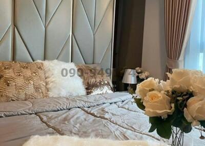 Elegant bedroom with luxurious bedding and decorative pillows