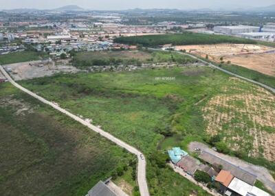 Aerial view of a vacant lot with surrounding development