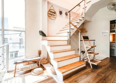 Modern apartment interior with open staircase and minimalist decor