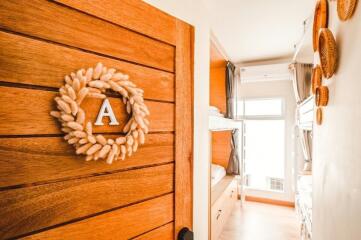 Cozy bedroom with wooden door and natural light