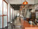 Modern industrial style cafe interior with concrete walls and large windows