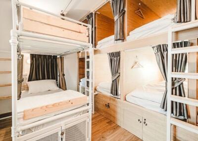 Compact bedroom with double-decker beds and wooden accents