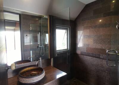 Modern bathroom with glass shower and vessel sink