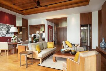 Elegant and spacious living room with wooden ceiling and modern furniture