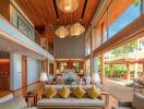 Spacious living room with high ceilings and modern tropical design
