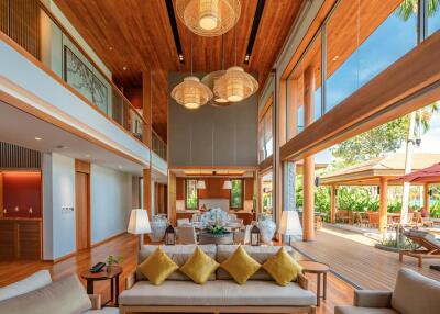 Spacious living room with high ceilings and modern tropical design