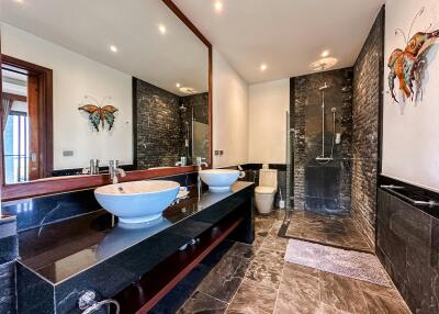 Modern bathroom with double vanity and walk-in shower