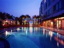 Elegant outdoor swimming pool area with ambient lighting