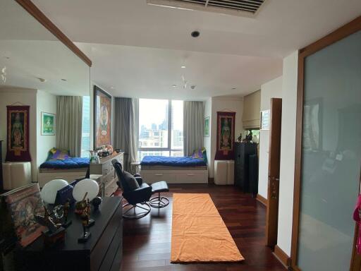Spacious bedroom with ample natural light and modern furnishings