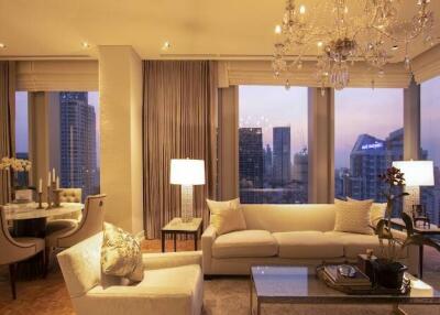 Spacious living room with modern furniture and city skyline view