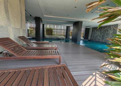 Outdoor swimming pool with lounge chairs
