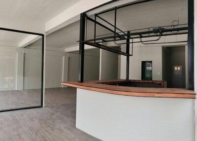 Open floor plan with mezzanine and large glass windows