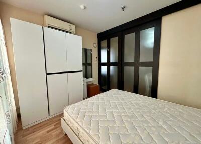 Cozy bedroom with wardrobe and air conditioning unit